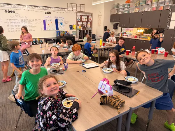 Kids in a classroom with ice cream